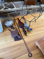 Overall lot layout showing log rack, bellows, broom, poker, shovel, ash pan, pot