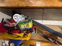 Assortment on shelf including Old Salt container, rod case, bags, rod sections