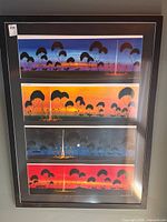 Full view of framed artwork showing four landscape panels