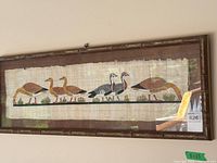 Framed papyrus artwork showing five Egyptian geese