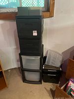 Stack of plastic drawer units with file box and organizer