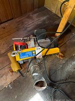 Top view of Power Fist hoist showing motor housing, control pendant and mounting