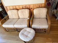 Loveseat with two-seat cushions and footstool in front