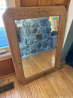 Full view of rectangular wooden wall mirror