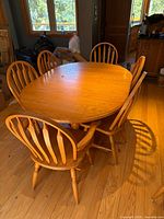 Dining table with six visible chairs around