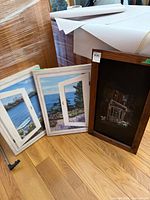 All three framed art pieces together