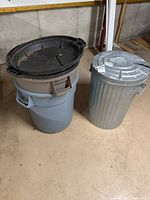 Both trash cans side by side
