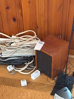 Front view of speaker, power strips, cables and Sennheiser base