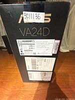 Front of sealed ASUS VA24D retail box with labels visible