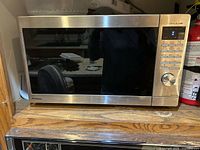 Front view of Panasonic stainless microwave showing door and control panel