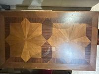 Top view showing wood veneer star inlay and finish wear