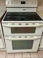 Front view of double-oven range showing cooktop and doors