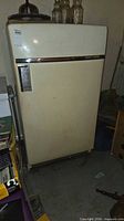 Front view closed showing cream exterior and chrome handle