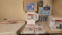 Overview of entire lot showing multiple boxed molds including Bell’s kit, Alberta’s boxes, Duncan case, Sinclair mold, small white cases