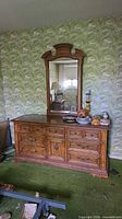 Front view of dresser with mirror attached showing full structure and finish
