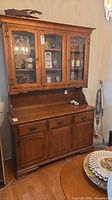 Full view of Vilas maple hutch showing glass upper display and lower storage