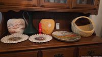 Group shot of all seven items on cabinet