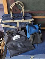 Group shot of all four travel bags and pouches
