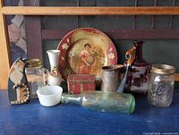 Full view of assorted vintage items on blue surface