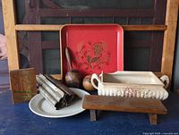 Group shot of all items including tray, planter, cutters, maracas, bench, plaque