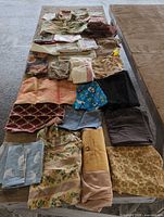 Full lot laid out on table showing variety of fabric pieces and sizes