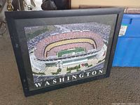 Front view showing framed stadium print
