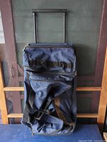 Front view showing extended telescoping handle and overall bag