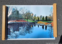 Full view of large photographic print with wood rails