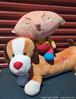 Stewie pillow sitting on dog pillow