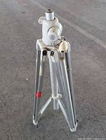 Full view of folded tripod showing legs, head and overall condition