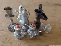 Group shot showing all eight miniature items