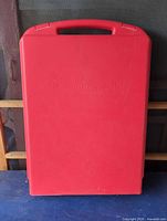 Closed red Ornament Safe case front view showing handle