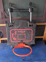 Front view showing backboard, graphics, and detached rim
