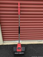 Full view of Toro corded electric power shovel standing upright