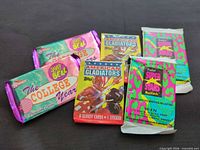 All six sealed trading card packs displayed