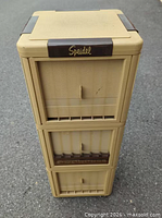 Front view of full tower showing three trays and Speidel branding