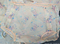 Single diaper cover showing pattern and trim