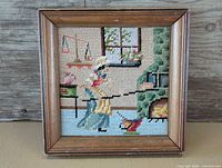 Front view of framed needlepoint