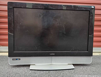 Front view of Vizio 32-inch TV on stand