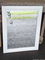 Front view of mirror showing full frame and decal