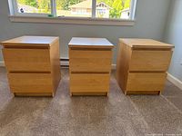 Front view of three matching nightstands