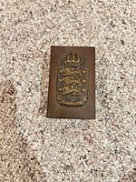 Front view showing brass holder with Danish coat of arms and DANMARK text