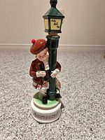 Full view of ceramic figurine and base