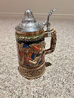 Front view showing musician relief scene and handle detail