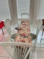 Full view of glass dining table and chairs