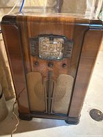 Front view of RCA Victor console radio showing cabinet and dial
