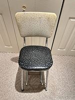 Stool front view, steps folded in