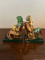 Side view of both Marbolex figurative bookends back to back