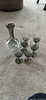 Full view of decanter with six matching silver fade glasses