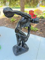 Full view of the Discobolus statue showing pose, finish and overall condition